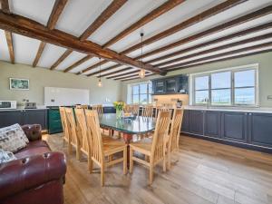 a kitchen and dining room with a table and chairs at The Chestnuts in Tenbury