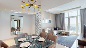 a living room with a dining table and a living room at Primestay - 2BR Damac Prive in Business Bay in Dubai