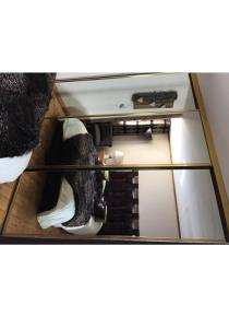 a glass cabinet with a view into a room at R&eacute;sidence Le Galibier 3 66910 in Les Deux Alpes