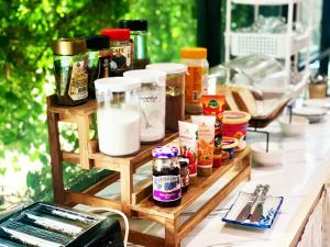 a counter topped with lots of different types of ingredients at Three Bridges Hotel in Nan