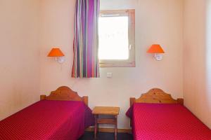 Ένα ή περισσότερα κρεβάτια σε δωμάτιο στο Résidence Les Valmonts - maeva Home - 2 pièces 4 Personnes Sélection MAE-9471