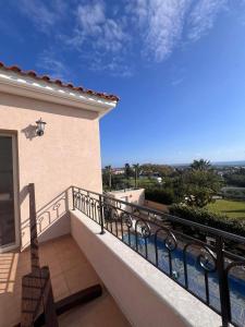 a balcony of a house with a view of the ocean at ROSE VILLA - 3 BED POOL in Episkopi Limassol