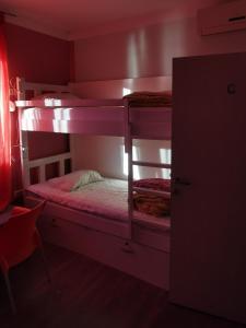 a bedroom with two bunk beds in a room at High Hostel in Budva