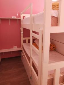 a room with bunk beds and a ladder at High Hostel in Budva