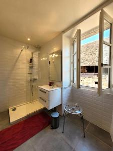 a bathroom with a shower and a sink and a window at Gîte de France Gîte la chapelle 3 épis - Gîte de France 6 personnes 904 