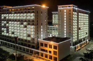 a view of a building at night with buildings at Westin Lucknow in Lucknow
