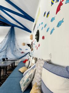 Ein Bett oder Betten in einem Zimmer der Unterkunft Pension Hibiscus Taha'a