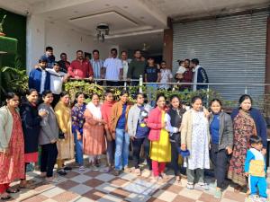 a group of people posing for a picture in front of a crowd at Abrol residency in Katra