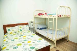Postel nebo postele na pokoji v ubytování Homestay HoLo