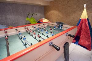 a bowling alley with a group of people in it at Etoile des Neiges Piscine Spa Sauna in Métabief