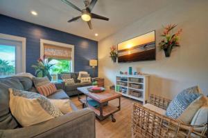 a living room with a couch and a table at Rock N Reel by AvantStay Old Town Location in Port Aransas