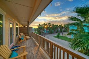 a porch with chairs and a view of the ocean at Rock N Reel by AvantStay Old Town Location in Port Aransas