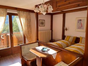 a living room with a couch and a table at Landhaus Töchterle in Telfes im Stubai