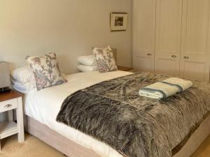 a bedroom with a bed with a blanket on it at Heilfontein Country Escape in Hartebeest Rivier
