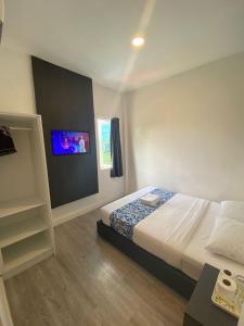 Hotel Apsara Temerloh Gateway客房内的一张或多张床位
