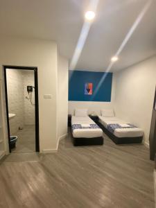 Hotel Apsara Temerloh Gateway客房内的一张或多张床位