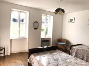 Ένα ή περισσότερα κρεβάτια σε δωμάτιο στο Gîte de France Chez yvette 3 épis - Gîte de France 6 personnes MAE-0204