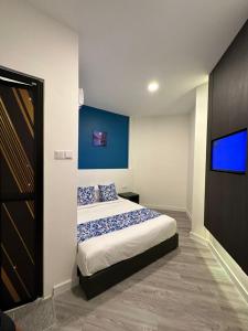 Hotel Apsara Temerloh Gateway客房内的一张或多张床位
