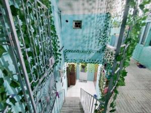 a model of a building with a stairway at Sweet Home Hostel in Baku