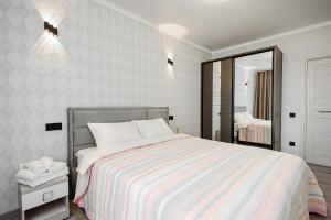 En eller flere senge i et værelse på Modern Escape in Chisinau