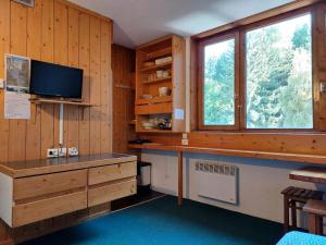 Kuchyň nebo kuchyňský kout v ubytování Résidence Nova - Studio 2 personnes, proche des pistes et des commerces, au cœur de la station d’Arc 1800 dans le village des Villards MAE-1858