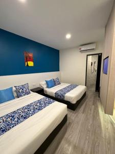 Hotel Apsara Temerloh Gateway客房内的一张或多张床位