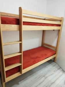a couple of bunk beds in a room at Résidence Rond-Point-pistes I - 2 Pièces pour 8 Personnes 244 in Orcières
