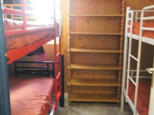 a room with two bunk beds and a staircase at Résidence Rond-Point-pistes I - 3 Pièces pour 8 Personnes 254 in Orcières
