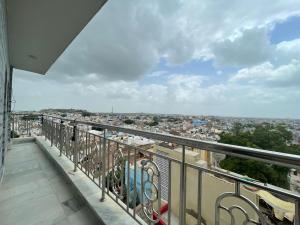 a balcony with a view of a city at Anne Guest House in Jodhpur