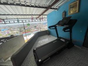 a room with a treadmill in a room with a window at Anne Guest House in Jodhpur