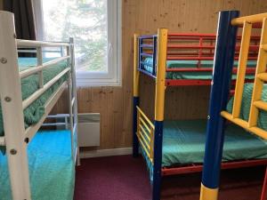 Una cama o camas cuchetas en una habitación  de Résidence Rond Point Pistes - Pièces 744