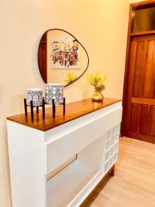 a dressing table with a mirror on top of it at Pishon Home in Dar es Salaam