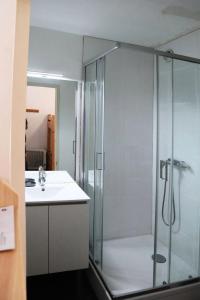 a bathroom with a shower and a sink at Résidence ORR DES CIMES - Studio pour 4 Personnes 594 in Les Orres
