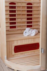 a wooden hutch with towels in it at Le Case di Maggie in Isolabona