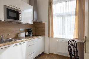 Kuchyň nebo kuchyňský kout v ubytování Anyday Apartments