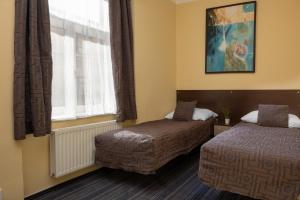 Postel nebo postele na pokoji v ubytování Anyday Apartments