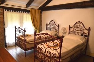 Un pat sau paturi într-o cameră la Agriturismo La Pieve