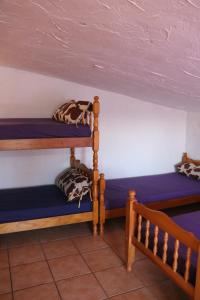 two bunk beds sitting next to each other in a room at Casa rural para grupos in Ayora