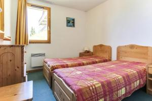 Posteľ alebo postele v izbe v ubytovaní Résidence Presles - Appartement duplex de charme 4 pièces 8 personnes à Vallandry dans un quartier calme et proche des pistes MAE-2004