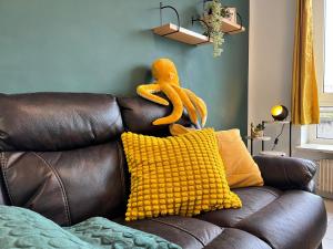 a stuffed animal is sitting on top of a couch at Wohnung in Oberhausen-Zentrum in Oberhausen