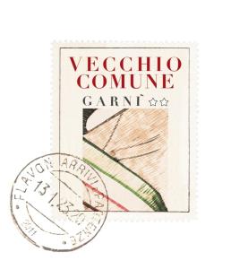 a book with a picture of a vueblo committee card at Garnì Vecchio Comune in Flavon