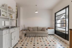 A kitchen or kitchenette at TRULLO SANTA PAZIENZA 6&3, Emma Villas