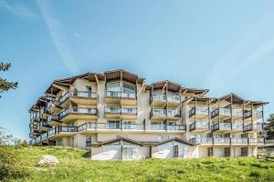 a tall building on top of a hill at Résidence Le Pédrou - maeva Home - Studio 2 Personnes - Confort MAE-3956 in Font Romeu Odeillo Via