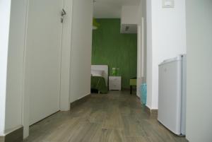 a hallway with a room with a green wall at Alicata B&b La Dimora Del Vento in Licata