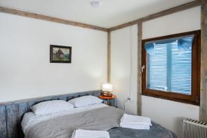 Posteľ alebo postele v izbe v ubytovaní Akut Hotel