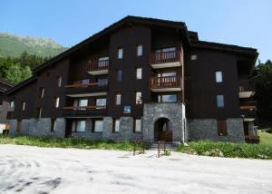 a large black building with balconies on it at PIERRER G - Appartement PIERRER 10 pour 4 Personnes 41 in Valmorel