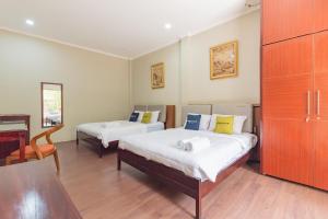 Postel nebo postele na pokoji v ubytování Urbanview Resort Botol Cisarua Puncak Bogor + 37 fotografií