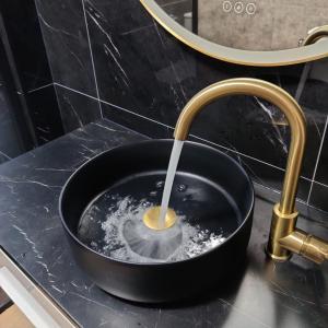 a kitchen sink with a faucet pouring water into a bowl at Modern Top Floor Apartment 60m2 - Balcony with Pool & Sea View - Vilamoura in Vilamoura