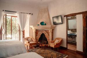 Ένα ή περισσότερα κρεβάτια σε δωμάτιο στο Zahar Boutique Stay Volcano Views and Pool