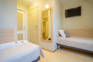 Postel nebo postele na pokoji v ubytování Kongo Hotel